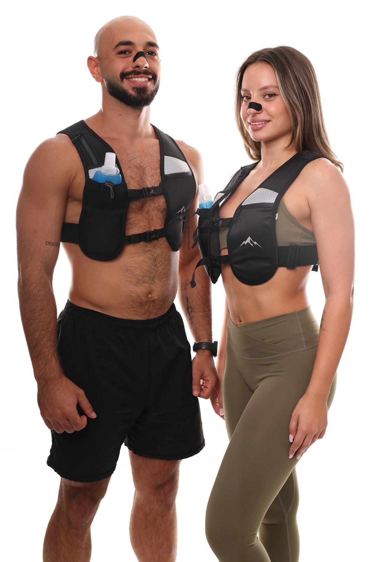Two runners wearing the Peak Running Vest with the soft flask and nasal strips